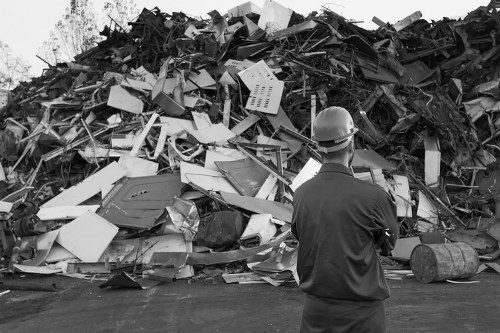 Construction site with builders managing waste clearance